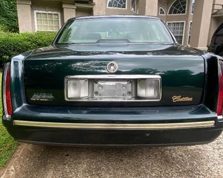 1997 Cadillac Deville
194880  miles 
Dark green with pinstripping and gold accents. 