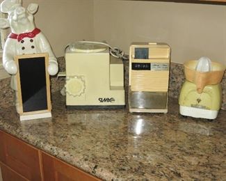Vintage Counter Top Appliances; Pig with menu board - $28; Simac Pastamatic - $50; Udico Ice Crusher - $25; Vintage Juicer - $12