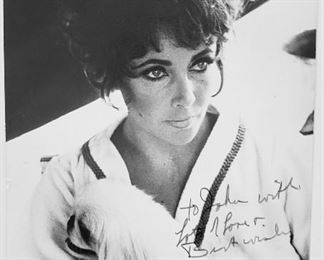Most Important Photo, as this has her beloved Pooch and is signed:  "Elizabeth Taylor Burton." $750 -$950