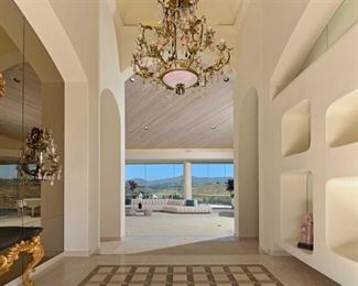 Magnificent Chandelier $4,000 and 2 sconces $4,000- Rose Quartz , Rock Crystal - please note the sofa is sold