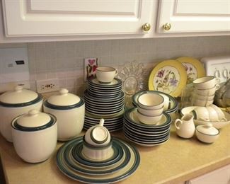 Pfaltzgraff 59 pieces.  7 dinner, 8 salad plates, soup bowls, cups and saucers.  1 ramekin, 3 fruit bowls, large round platter, 2 vegetable bowls, oval serving bowl and 3 canisters with lids.