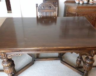 Mahogany dining table with inset leaves.  