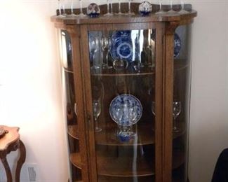 Convex glass curio cabinet.  Flow blue plates and bowl.  Lenox crystal "Ariel" with platinum rims.  13 water glasses and 13 wine goblets.