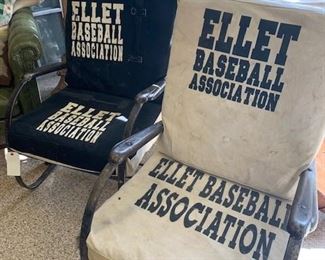 Remarkable pair of Vintage Baseball Loge chairs. Industrial frame that allows you to sit or rock. All metal and fantastic. Original vintage Ellet Baseball Association slipcovers. One cream, one black. Some patchwork which makes the look even better. These came out of a New York Yankees Stadium loge originally. $675 pair. 