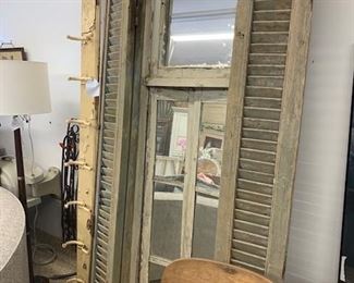 Tall antique French mirror with shutters. All original. From France. 1800s. It is was originally a French window with shutters made into a mirror. Ware appropriate with age. Approx. 7 feet tall. $485