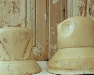 Pair of clay hat molds from Belgium. Beautiful and unique. Late 1800s. Great condition. Inside has a bar that holds them together. Fits on hat stands. $245 for the pair