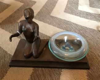 1920s Art Deco nude bronzed ashtray and figural. The ashtray is not original and was replaced later. It is still vintage but not original to Deco piece. Measures 9"  x 4.25" x 5.5." Some wear to spelter. Great Art Deco collectible piece. $59