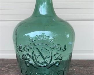 Large glass embossed Wine Jug. This is newer, not old. Measures 18" x 10" and is $28