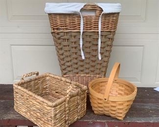 Set of three baskets. One hamper measuring 23" x 16" x 17" with liner, round one is 9 1/2" x 11" and rectangular one is 9" x 6" x 12" and has handles. All three are a set for $22 and all in great shape. 