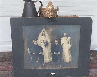 Lot of older collectibles. Large vintage wedding photo with signature on back. Measures 17" x 14", one vintage metal handled rustic pitcher measures 5" high and one vintage like inspired crown made from metal which measures 4" round. All three items in lot $15