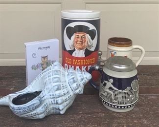 Collection of vintage porcelains. Buying as a lot. Includes vintage porcelain shell planter, Quaker Oat cookie jar (new), Tennis beer stein with indented mark on bottom we can't make out and pewter lid, Nova Scotia beer mug marked DBE on bottom and a brand new "Little Renegade Mindful Kids game. All for $20