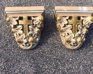Pair of incredible plaster church corbels with original gold and cream paint accents. Horsehair and plaster. There is an iron hanger hook built into the back of each one. Date to 1880s. Hand painted. Timeworn chippiness. The back is flat and can be hung as shelves. Retrieved from a Southern demolished church. Measures 12" high, 10" across and 5" in depth. $375 pair