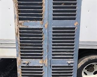 Pair of original 1800s French window shutters with original hardware, original blue paint. Pair is $125. This is one pair of a total of two we have to offer. Other pair in next photo. Measures 78 3/4" x 39 "
