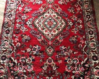 Vintage area rug in vibrant reds, creams, navy and light blues.Some wear from age throughout but a simply stunning rug. Measures 51.75" x 75" - $175