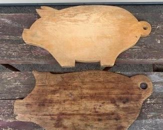 Two primitive pig cutting boards. Each measure 17" x 18 1/2". The bottom one has a hook on the back for hanging, the other does not. All wood. Primitive decor. Price for each is $32 You can buy one or the pair. 