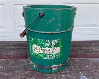 Primitive green wood bucket with wood handle. Original advertising label on front. Great shape. Measures 12" high, 7" diameter at top. $35