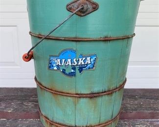 Large Primitive antique wooden bucket with handle. Original Alaska advertising sign adhered to front. In great shape and beautiful teal green color. Measures 13 1/2" high x 11" diameter at the top. Wooden handle is painted orange wood. All original A beauty! $75