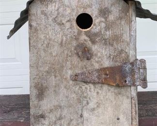 Very large handmade rustic birdhouse. Old hardware throughout and old tin roof. Heavy for size. Measures 25" x 19 1/2" x 12 1/2" and is made from old heavy hardware and wood. Very primitive and rustic look. $60