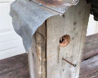 Smaller handmade rustic birdhouse using old hardware and metal roofing. Measures 14 1/2" x 12" x 7" and is a lovely piece of primitive garden decor. All handmade and lovely. Heavy for size. $38