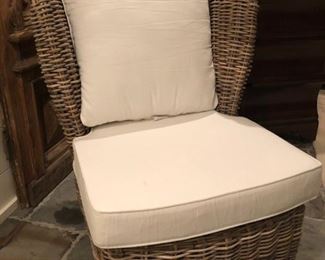 Heavy wicker wingback chair with cushions. In excellent condition. Measures 34 1/2" high, 29" deep. Barely used, like new $100