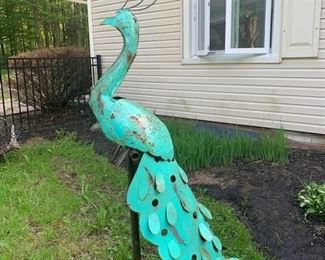 Tall Peacock garden ornament on iron stand. 62" high. Painted metal. $125