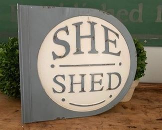 Large She Shed sign, metal, with side bracket for hanging. Two sided so each side is the same. Measures 14" x 13" x 2 3/4" - Vintage inspired so newer made to look old as it is a distressed paint finish. $42