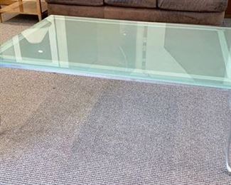 Monumental Modern glass coffee table with chrome legs. The glass is very heavy so bring two people to lift. It is about an inch thick of beveled frosted glass and comes off the table for transport. Beautiful contemporary look. 53" x 36" x 19" Great condition. $75