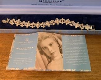 Brand new in box Newbridge (Ireland) Princess Grace collection bracelet. Pearl composition and rhinestone. Pearls in center florets. Everything in excellent shape. Comes in original velvet lined box with Princess Grace Collection insignia on front. Bracelet measures 7 1/2" across when lying flat. $35