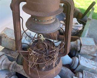 Old rusty lantern which makes great decor with remnants of birds nest. 14" - $12
