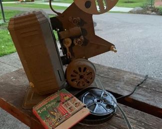 Great vintage film machine with two reels to go with it. What a great prop or decor piece. Grey in color. All intact. $28