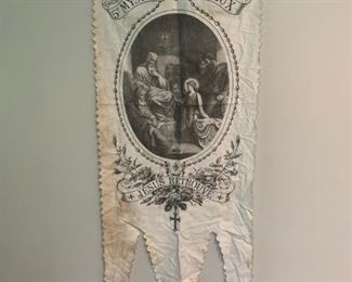 Third one of collection. This is a rare French church ceremonial banner. Slightly larger than the other two being offered. It features the 5th Joyful Mystery and Finding in the Temple. The Jesus Retrouve translates to Jesus Found in Temple. Hand inked litography on French Linen. Each of these are direct from France. Measures 39" x 16". There is no rod in this one but one can be fitted and this can be hung like the others. Soiling typical of age but does not detract. This would have been used in a church ceremonial procession. Just beautiful and Rare! $175