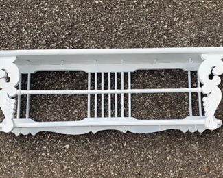 White shabby dish rack/wall shelf. Painted White. Measures approximately 3  1/4" feet wide and 19" high. Has two loops at top for hanging. Nice piece. $29