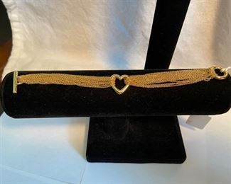 Tiffany & Co 18K (750) Gold Heart Toggle Bracelet,
7” long, 25.8grams, includes Tiffany box & pouch	      Asking   $2500
