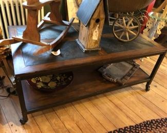Industrial Coffee Table crafted from Wood, Steel and Stone. Table is on wheels for ease of movement. $500.00 (item located in storage, please contact if interested and we will arrange for the item to be on-site the day of the sale)