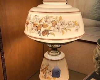 Pair of Hurricane Lamps, Tan Floral Pattern $150.00 (item located in storage, please contact if interested and we will arrange for the item to be on-site the day of the sale)