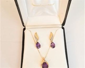 Lot #32  14kt gold necklace with oval amethyst/diamond accents, pair matching 14kt gold earrings.