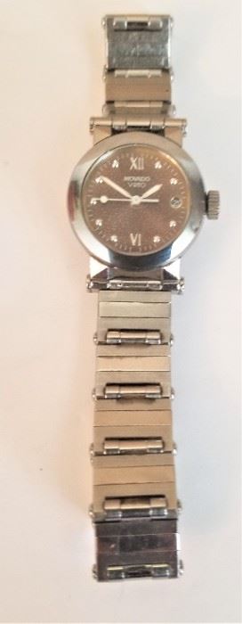 Lot #33  Ladies Movado watch - tells time/date.  No battery