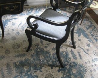 Area rug with center medallion, desk with chair