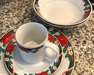 $15 for Christmas plates set includes 3 mugs, 2 serving bowls, 12 salad and 12 dinner plates