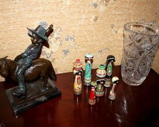 Metal cowboy sculpture, painted wood figurines, large crystal vase