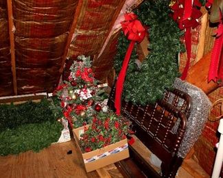 Christmas decor - lots of garland / wreaths, full bed
