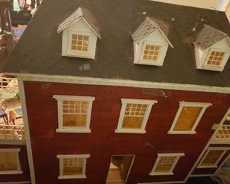 #135 $300 Vintage doll house about 3ft wide 2 ft tall 12 deep. Has extraordinary contents right down to miniature cookbook and Monoploy game. Rare find like this