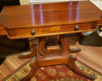 #135 $400 Antique Lyre base table About 4 ft wide 20 deep 30 tall. Dovetailed drawers and brass pawfoot feet