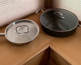 #20.         PENDING PAYMENT.    $18
2pc. Fry pan Lot
Fissler Covered Fry Pan-10 1/4” (Germany)
Emeril Covered Fry Pan-13”