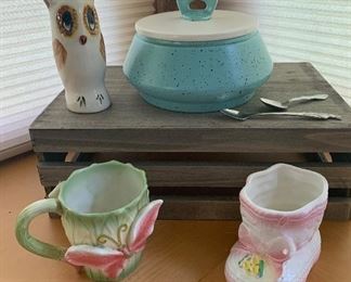 #95.         $12
Owl bank, Baby shoe planter, 2 baby spoons, Butterfly Mug, California pottery Casserole. Casserole has crack on side.