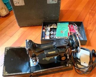#140.      $250
Singer Featherweight sewing machine. Great condition, new foot pedal 
