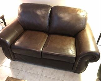 Brown leather sofa and matching loveseat
