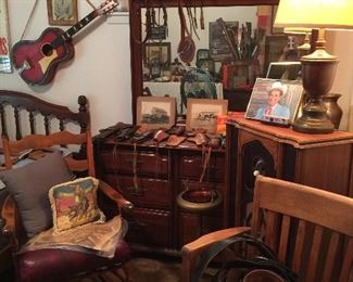 Hank Williams, more leather holsters of the dressing table, brass lamp with shade, lots of belts