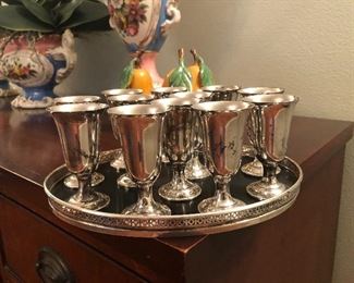 Antique Fisher sterling silver apertif set.  Twelve stems with sterling and ebony tray.  Beautifully pierced on rim of tray.  Excellent condition.