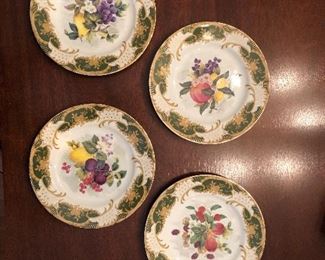 Four plates, by Andrea by Sadek.  “Antique Fruit” pattern.